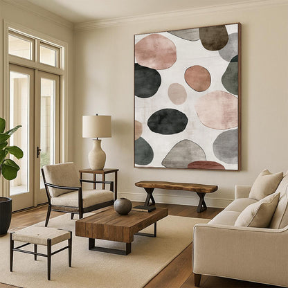 Contemporary hand-painted abstract artwork features a serene design of overlapping circles and pebbles in shades of gray with brown green and pink accents. DLZ1646