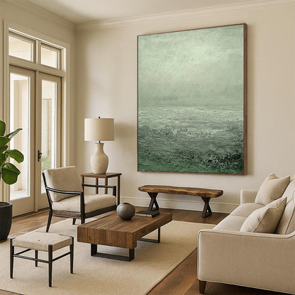 Contemporary hand-painted abstract art featuring a serene gray-green sea with ripples and soft clouds creating a tranquil atmosphere. DLZ1276