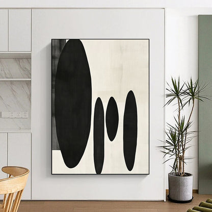 Contemporary minimalist artwork featuring organic black shapes balancing large forms on the left with delicate smaller shapes on the right. DLZ1547