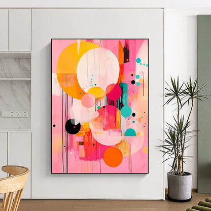Contemporary abstract painting features large circles and colorful shapes on a pink background with black lines and orange accents in a joyful style. DLZ0763