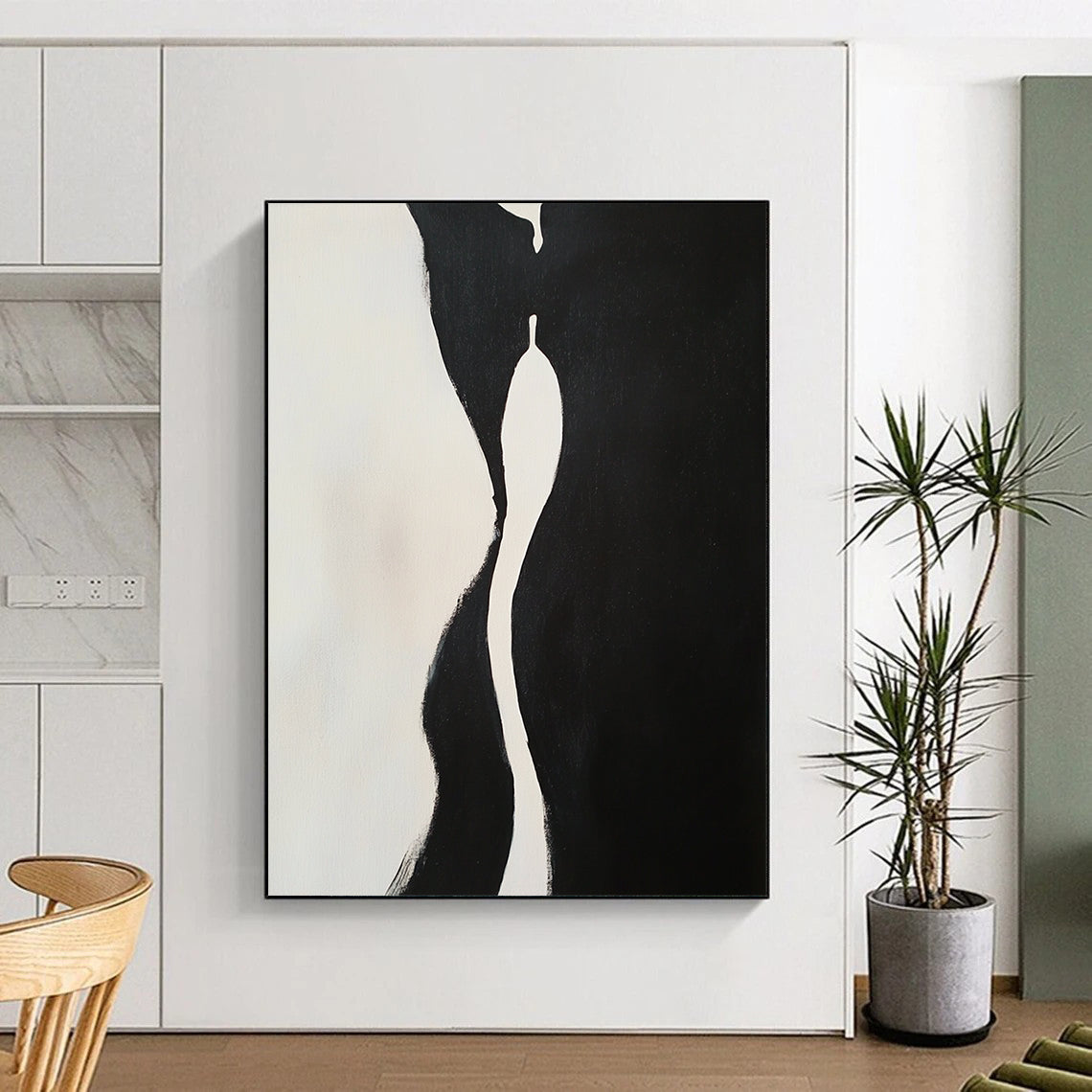 Contemporary hand-painted abstract artwork features two embracing figures with dynamic shapes and compelling negative space in a striking black and white composition. DLZ1543
