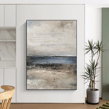 Contemporary abstract painting captures the ocean's essence with textured brushstrokes in muted gray and blue tones for a vintage feel. DLZ1077