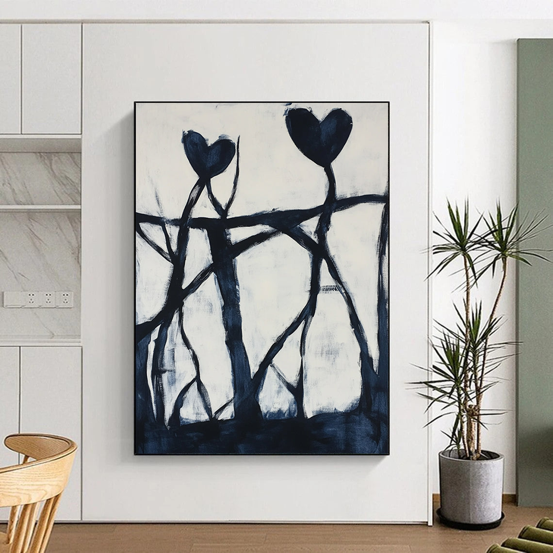 Contemporary hand-painted abstract artwork featuring dynamic black shapes, intricate patterns, and bold hearts against a pure white background. DLZ1398