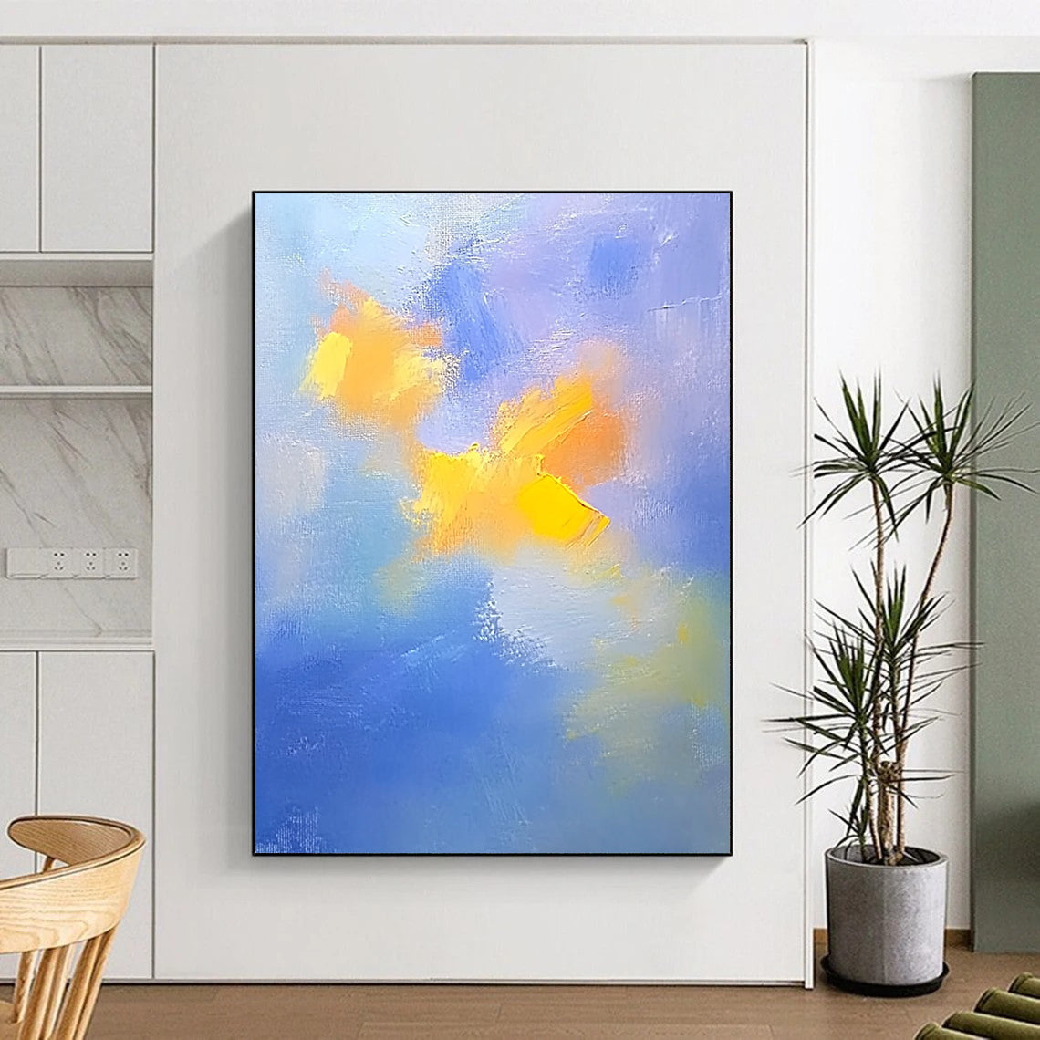 Contemporary abstract painting featuring soft blue and yellow clouds with gentle oil strokes on canvas, inspired by the style of Cuno Amiet. DLZ0354