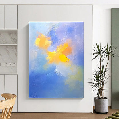 Contemporary abstract painting featuring soft blue and yellow clouds with gentle oil strokes on canvas, inspired by the style of Cuno Amiet. DLZ0354