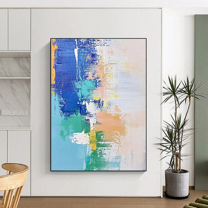 Contemporary hand-painted abstract artwork features soft pastel shades of blue and white with hints of green and beige, enhanced by dynamic brush strokes and mixed media. DLZ0657
