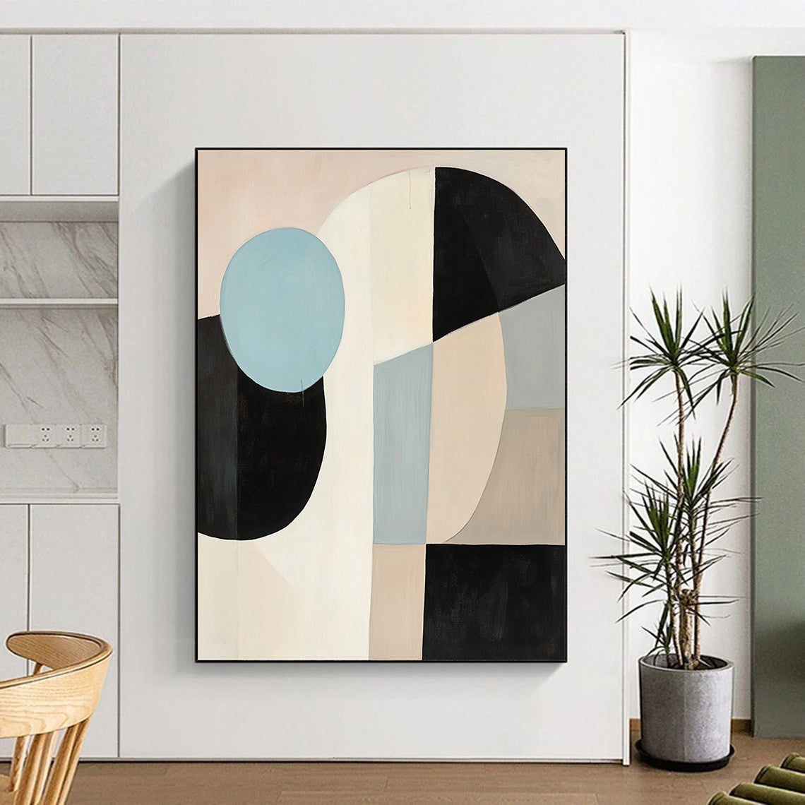 Contemporary abstract painting featuring large black white and beige shapes with a blue circle on a light pink background in soft minimalist style. DLZ1040
