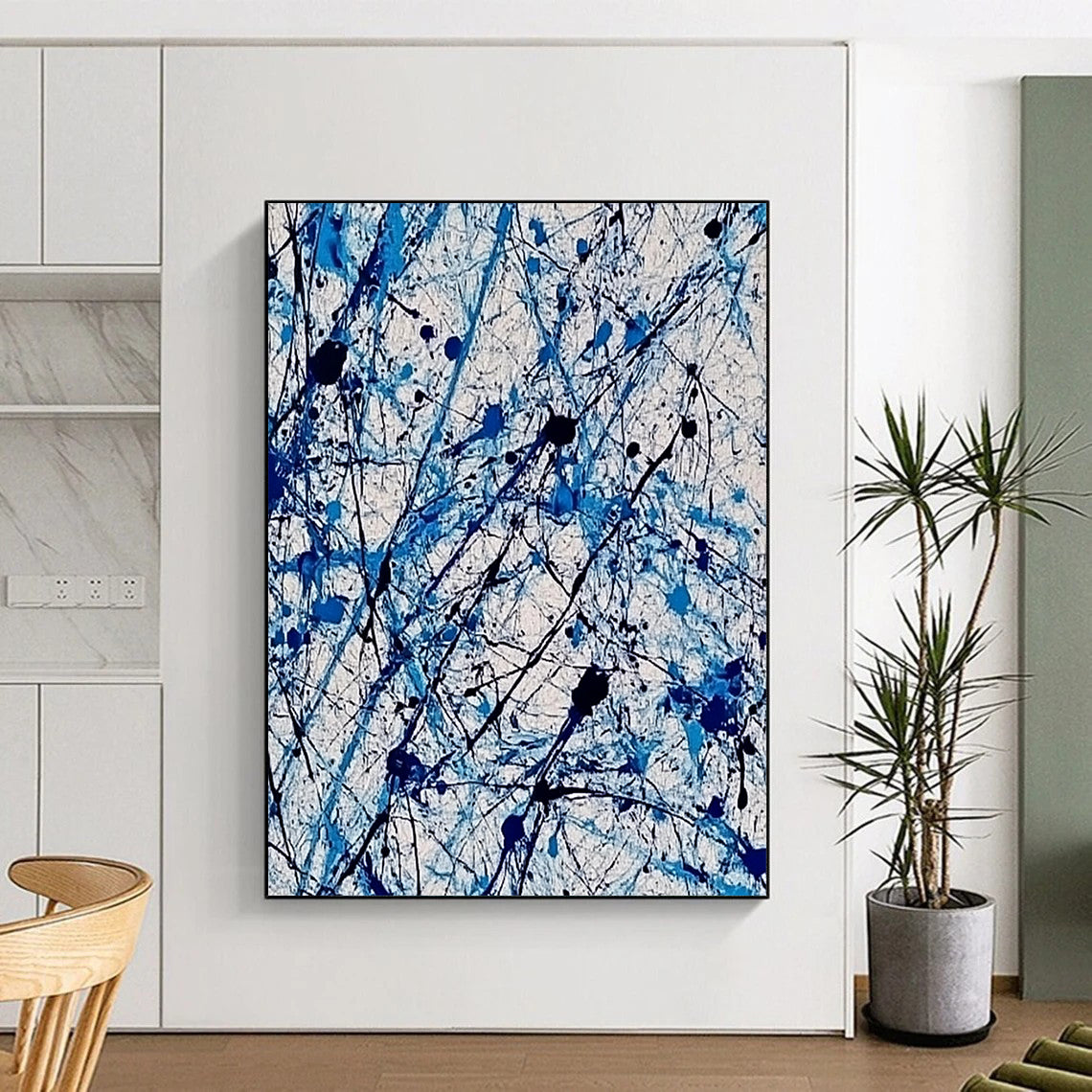 Contemporary abstract painting features vibrant blue and white ink splashes with lace-like patterns creating dynamic movement and evoking joy. DLZ1410
