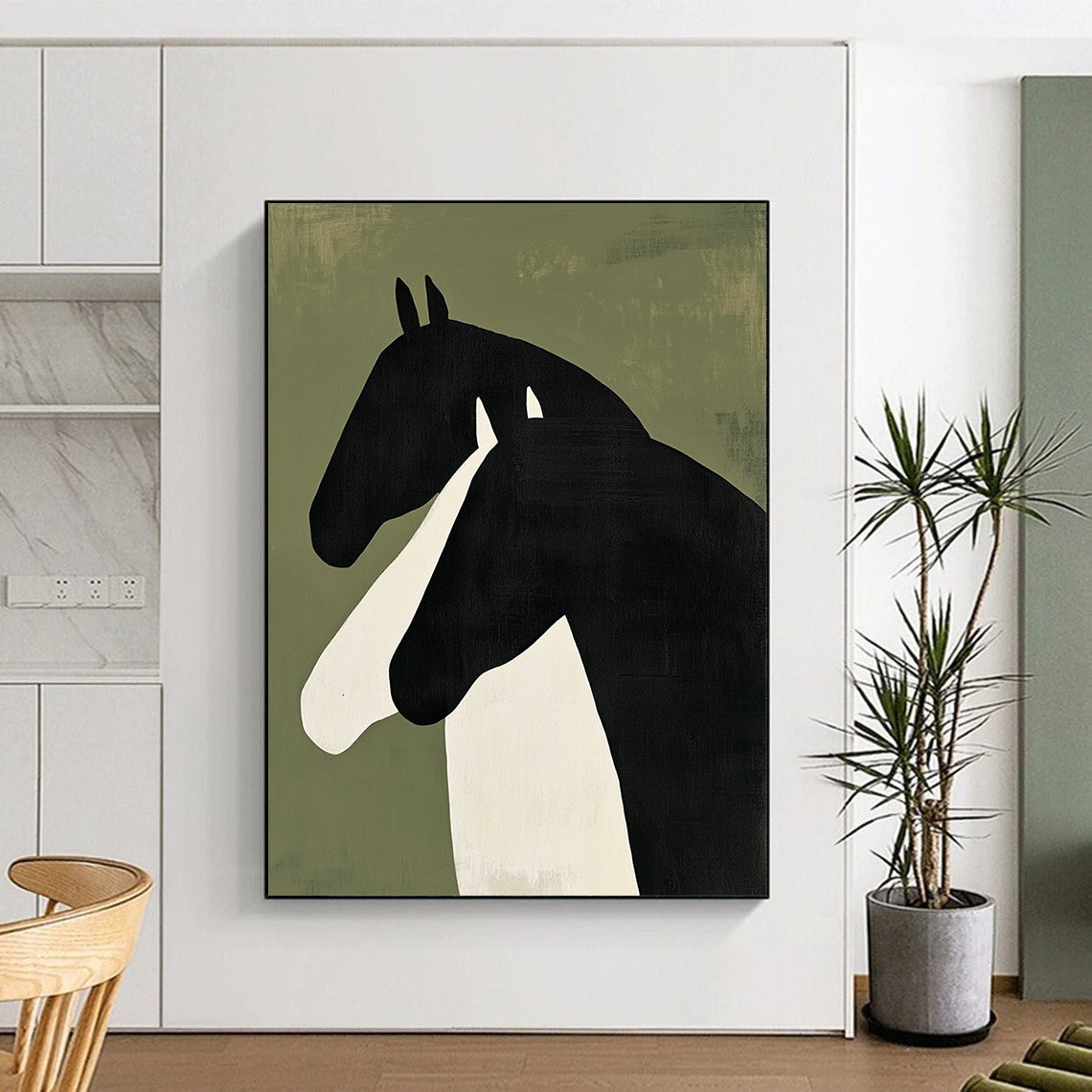 Contemporary abstract painting featuring two horses in profile – bold black shapes with white accents on green background, creating a striking minimalist visual. DLZ1325