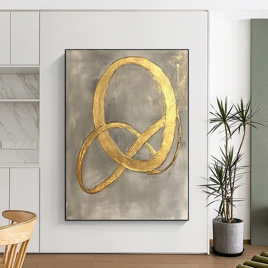Contemporary hand-painted abstract art features intertwined shapes with elegant curves and delicate gold foil on a light gray background. DLZ1577