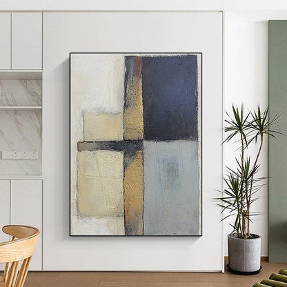 Contemporary abstract painting featuring textured gray and blue squares with serene beige tones on canvas creating a calm and balanced atmosphere. DLZ0983