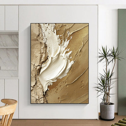 Contemporary hand-painted abstract art featuring a central white paint stroke adorned with gold glitter accents on a rugged stone-like background. DLZ1195