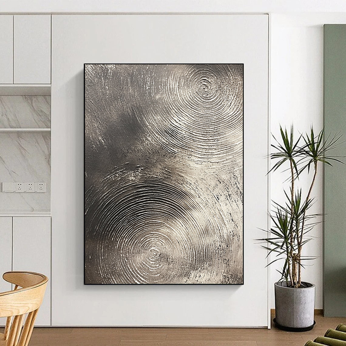 Contemporary abstract artwork features silver textures with swirling patterns on a dark gray background emphasizing depth and movement. DLZ1075