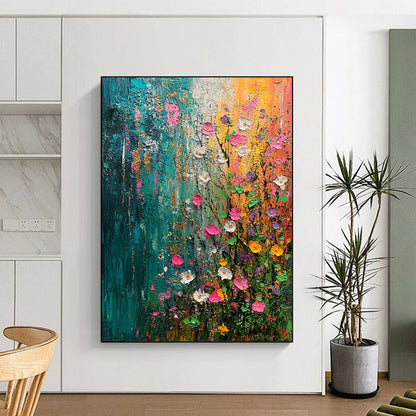 Contemporary abstract painting capturing spring's essence with vibrant flowers and trees in green blue pink and yellow accented by gold and silver textures. DLZ0644