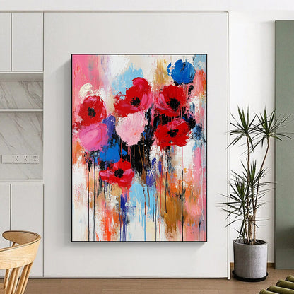Expressive contemporary abstract painting of flowers in vibrant red pink and blue with thick brushstrokes and texture capturing the warmth of springtime. DLZ0982