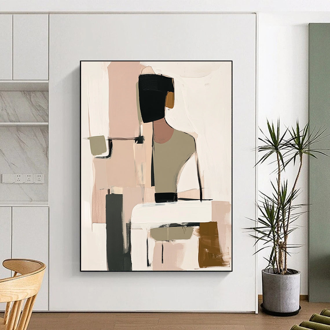 Contemporary handmade abstract art featuring muted beige black and white tones with soft pink and green hints and loose shapes around a visible table. DLZ0912