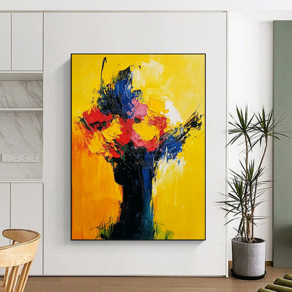 Contemporary abstract painting in vibrant yellow red and blue showcasing expressive flowers and a sunrise with visible brush strokes on oil canvas. DLZ0542