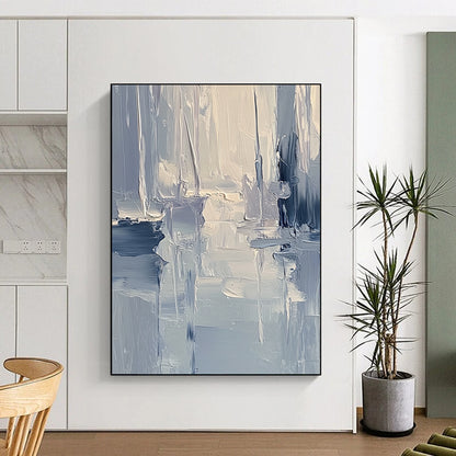 Large contemporary abstract painting featuring textured layers of blue and gray tones with soft lighting reflecting a serene coastal landscape. DLZ0352