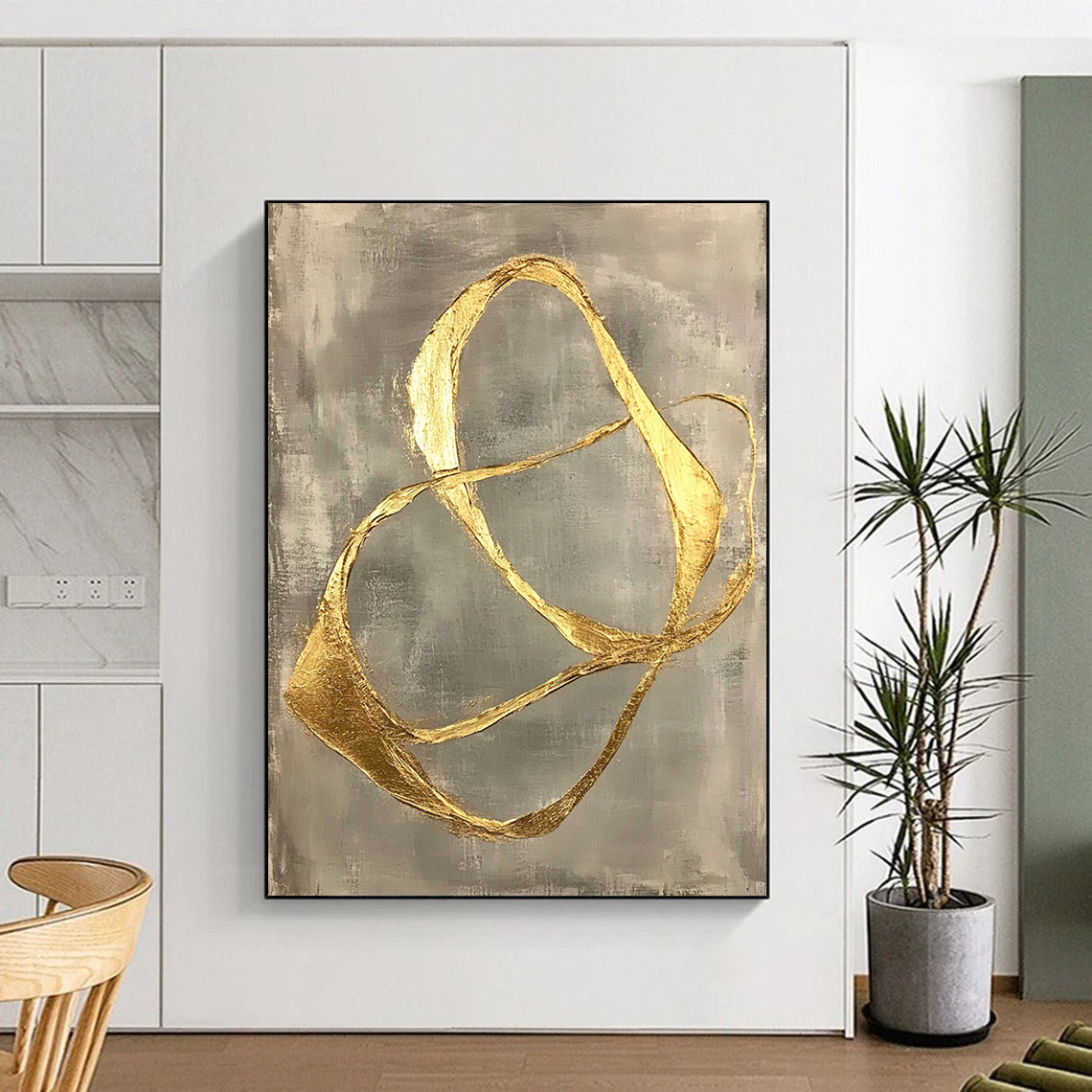 Contemporary abstract art featuring gold leaf-shaped lines on a gray background, showcasing organic forms and minimalist fluidity in a striking hand-painted design. DLZ1578